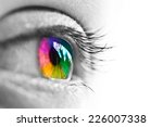 Girl colorful and natural rainbow eye on white background