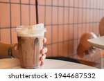 Hand  holding the glass iced cocoa, stock photo
