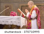 Small photo of ROME, ITALY - CIRCA JANUARY 2016 - A priest saying the traditional extraordinary tridentine latin rite of the Catholic mass in the basilica of St Nicholas in Rome