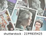 Small photo of LONDON, UK - September 2022: Front covers of national newspapers pay tribute to the Queen after her death