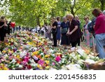 Small photo of LONDON, UK - September 2022: Thousands of people lay flowers and cards in Green park in tribute to Queen Elizabeth II after her death