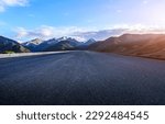 Small photo of Straight asphalt road and mountain natural background at sunset