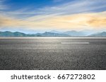 asphalt road and mountain background