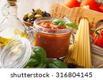 stock-photo-ingredients-for-spaghetti-with-tomato-sauce-on-wooden-background-italian-healthy-food-background-316804145.jpg