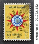 Small photo of IRAQ - CIRCA 1959 : Cancelled postage stamp printed by Iraq, that shows State Emblem of Republic of Iraq, circa 1959.