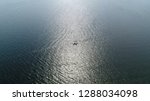 Small photo of High altitude aerial view of two sloops laying next to each other these are small sailing boats with a single mast and a fore and aft rig and one head-sail vessels 4k high resolution footage