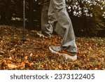 Nordic Walking in Autumn forest, hiking teenage girl. adventure and exercise concept, women