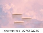 Small photo of Surreal podium outdoor on blue sky pink violet pastel soft clouds with space.Beauty cosmetic product placement pedestal present stand minimal display,summer paradise dreamy concept.