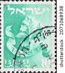 Small photo of Israel circa 1955: A post stamp printed in Israel showing the Emblem of Reuben (Tribe) Mandrake