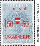 Small photo of Austria - circa 1956: a postage stamp from Austria, showing the coat of arms of the republick Austria with overprint: Relief for Hungarian Refugees