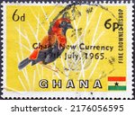 Small photo of GHANA - CIRCA 1965: a postage stamp from GHANA, showing a Fire-crowned Bishop (Euplectes hordeaceus) bird. overprint. Circa 1965