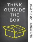 Small photo of Chalkboard with think outside the box written on it and is intended to be used as messaging for creativity and breaking the status quo for businesses, school and any marketing themes.