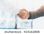 Business partnership meeting. Picture businessmans handshake. Successful businessmen handshaking after good deal. Horizontal, blurred background