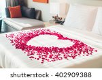 White pillow and Red rose flower on bed decoration in bedroom interior - Vintage Light Filter