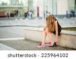 Young Woman Changes Shoes On...