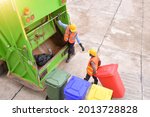 Workers collect garbage with Garbage collection truck,Garbage collection workers in residential area