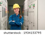Small photo of Portrait shot half body of young female electrical engineer in electrical control room, action thump up showing the good services working and professional concept.