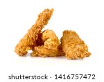 Fried chicken fillets on a white background. Fried chicken nuggets close-up.