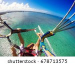 View Of Couple Parasailing With ...