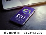 Small photo of DeFi - Decentralized Finance includes digital assets, smart contracts, protocols, and dApps built on a blockchain technology. Fintech concept with smartphone lying on a wooden table