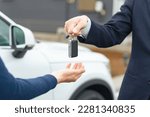Man handing car smart key. car...