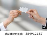 man and woman hand holding jigsaw puzzles, business matching concept