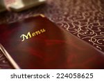 menu book on table in restaurant | Shutterstock . vector #224058625