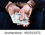 Man In Handcuffs With Money