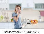 Young Woman Drinking Water From ...