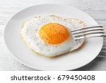 Plate with sunny side up fried...