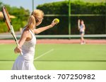 Young Woman Playing Tennis On...