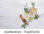 Beautiful composition with jar of hemp lotion on wooden background