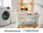 Basket With Laundry On Stool...