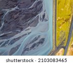 Aerial over Glacial river Meltwater mixed with natural mineral, Skaftafell river
sediment in river deltas creating stunning pattern Iceland, September 2021 
