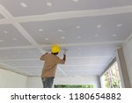 Construction man worker plaster gypsum ceiling for interior build gypsum board ceiling