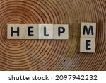 Help me symbol.
Wooden cubes words help me  background. Business, donate, motivational and help me concept.