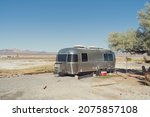 Small photo of Tecopa, California, USA - November 12, 2020: image of an Airstream camper shown parked in the desert.