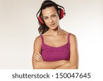 beautiful smiling young brunette posing with anti loud headset