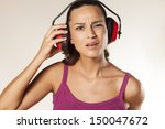 beautiful young brunette can not hear because of the anti loud headset