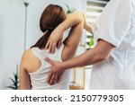 Small photo of Teen Girl having chiropractic back adjustment. Osteopathy, Physiotherapy, Kinesiology. Bad posture correction