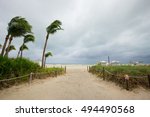 Hurricane Matthew and tropical storm. Miami Beach, South Beach, Florida. Incline weather, rain and wind. Dunes on a beach