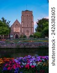 Small photo of Beautiful Canterbury Guildhall by River Stour under colourful summer sunset sky. Colorful blooming flowers and fairytale scenes while walking along the river that slowly flows through medieval town.
