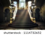 Entrance with symmetrical stairs of an abandoned casino. Sunlight shines through the windows and lights the darkness.