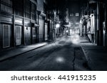 Moody monochrome view of Cortlandt Alley by night, in Chinatown, New York City