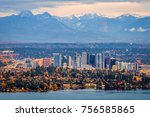 Bellevue Washington. The snowy Alpine Lakes Wilderness mountain peaks rise behind the urban skyline.