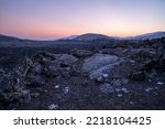 USA, Idaho, Craters of the Moon National Monument and Reserve. Lava field with dwarf buckwheat at sunset