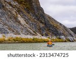 Usa, alaska, kotzebue, noatak river. kayaker on the noatak river. (mr)