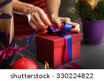 Gift wrapping. Woman packs gifts, step by step 