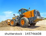 The Bulldozer Cleans Dirt On A...