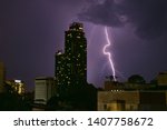 Small photo of Building night city was thunderclap, hit of lightning, strike of lightning storm thunder on dark sky.